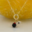 Dual Protection Necklace with Azabache and Evil Eye Charms - Gold