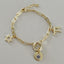 Protective Bracelet with Jewish Star, Hamsa and Chai Charms - Gold